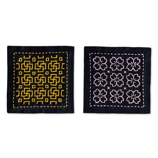 Olympus SK-480 hitomezashi sashiko coaster kit - two navy coasters stitched in tsubomi and sakura patterns