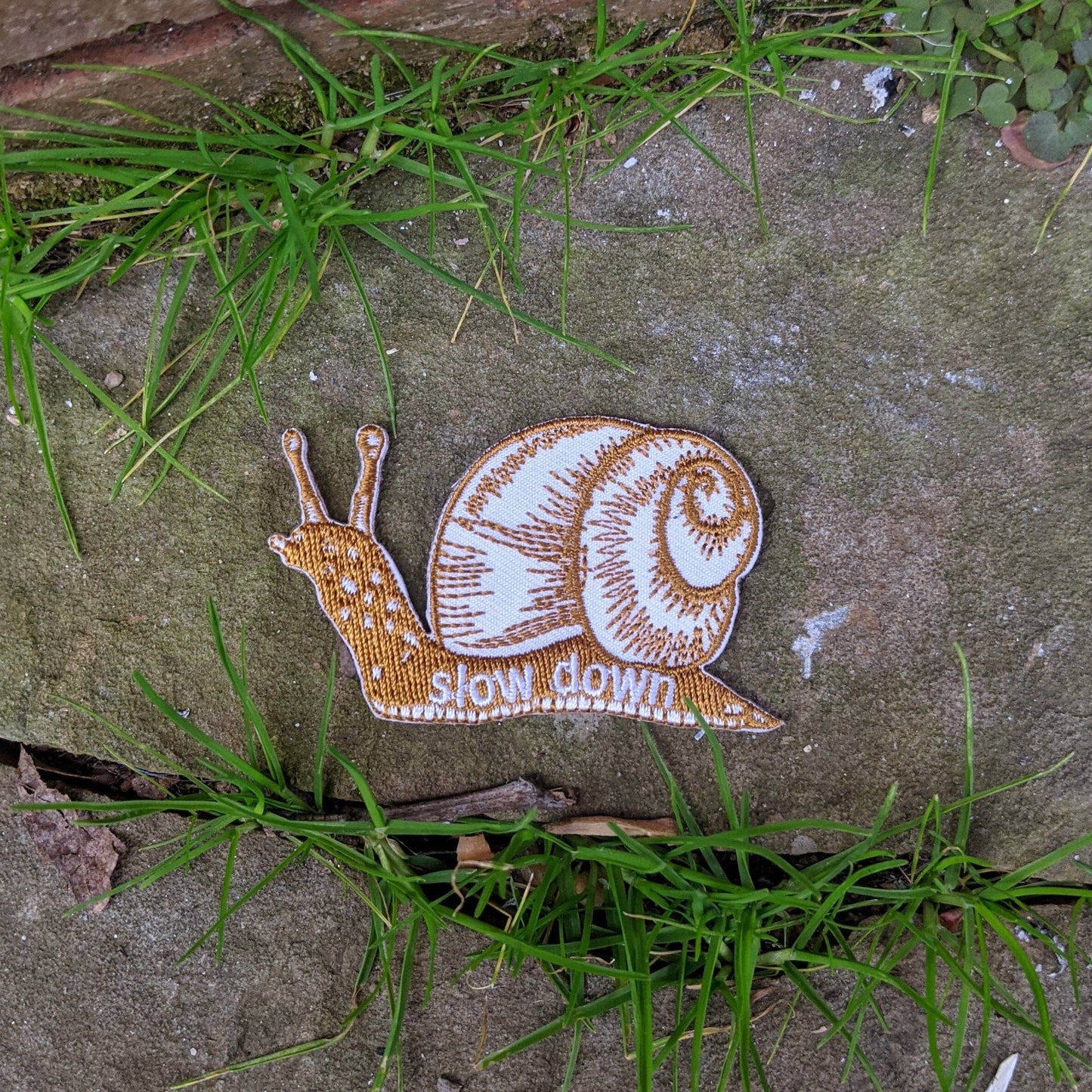 Iron - on patch | slow down snail - brown 1.6" x 2.6" - homesewn
