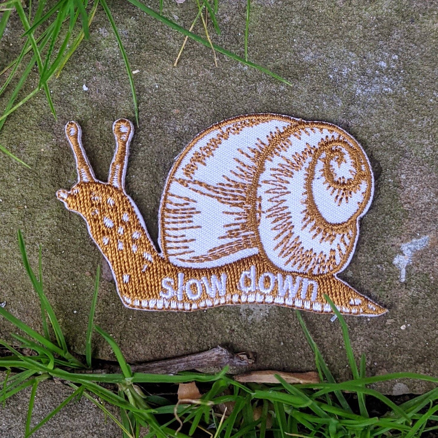 Iron - on patch | slow down snail - brown 1.6" x 2.6" - homesewn
