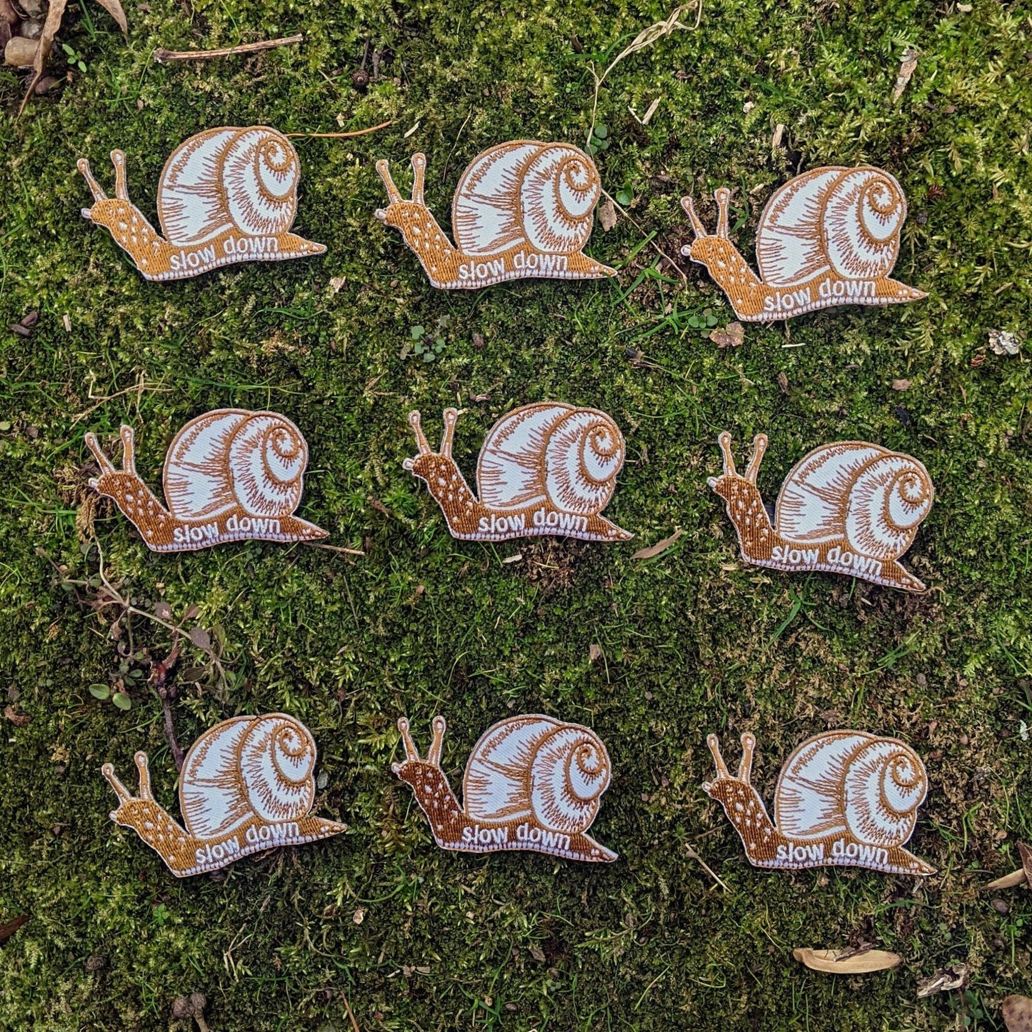 Iron - on patch | slow down snail - brown 1.6" x 2.6" - homesewn