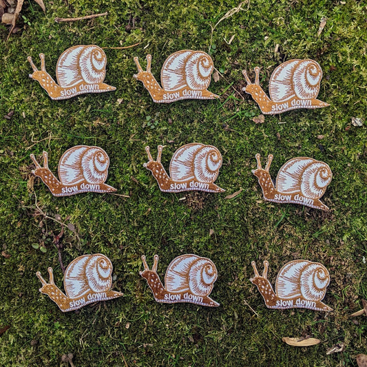Iron - on patch | slow down snail - brown 1.6" x 2.6" - homesewn