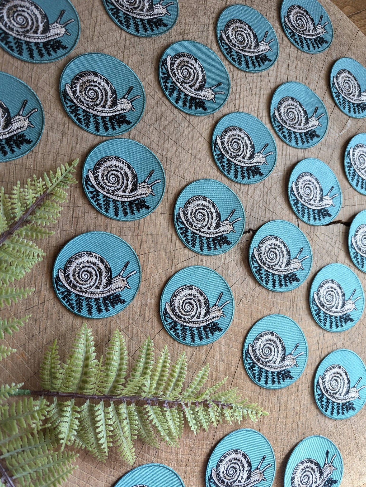 Iron - on patch | snail with fern - 2.5" round teal - homesewn