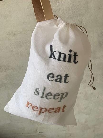 Project bag with embroidered text knit, eat, sleep, repeat